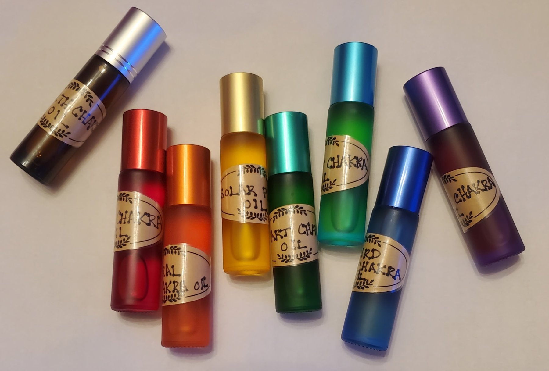 Colorful chakra aromatherapy roller bottles