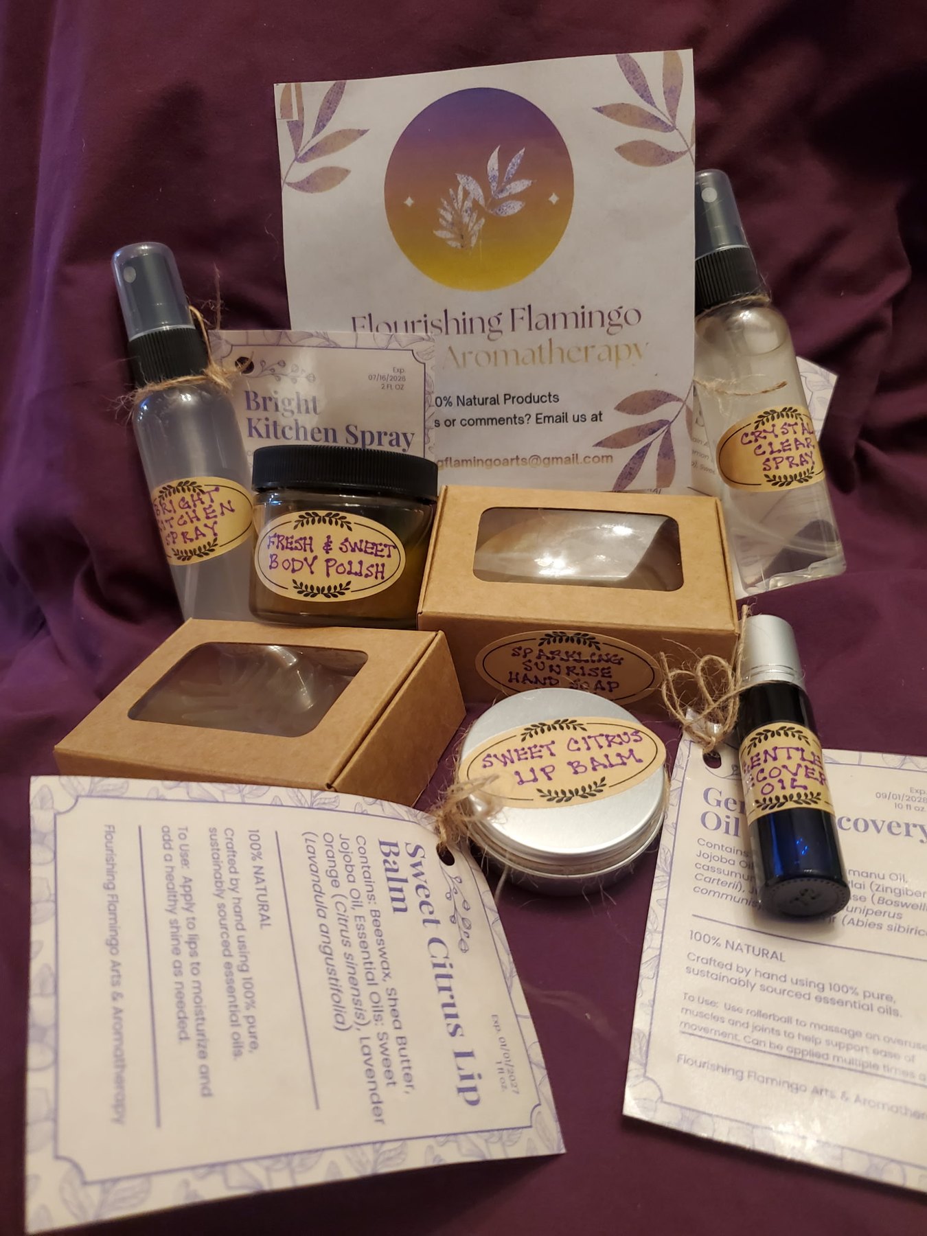 Kitchen spray, body butter, soap and lip balm on purple cloth