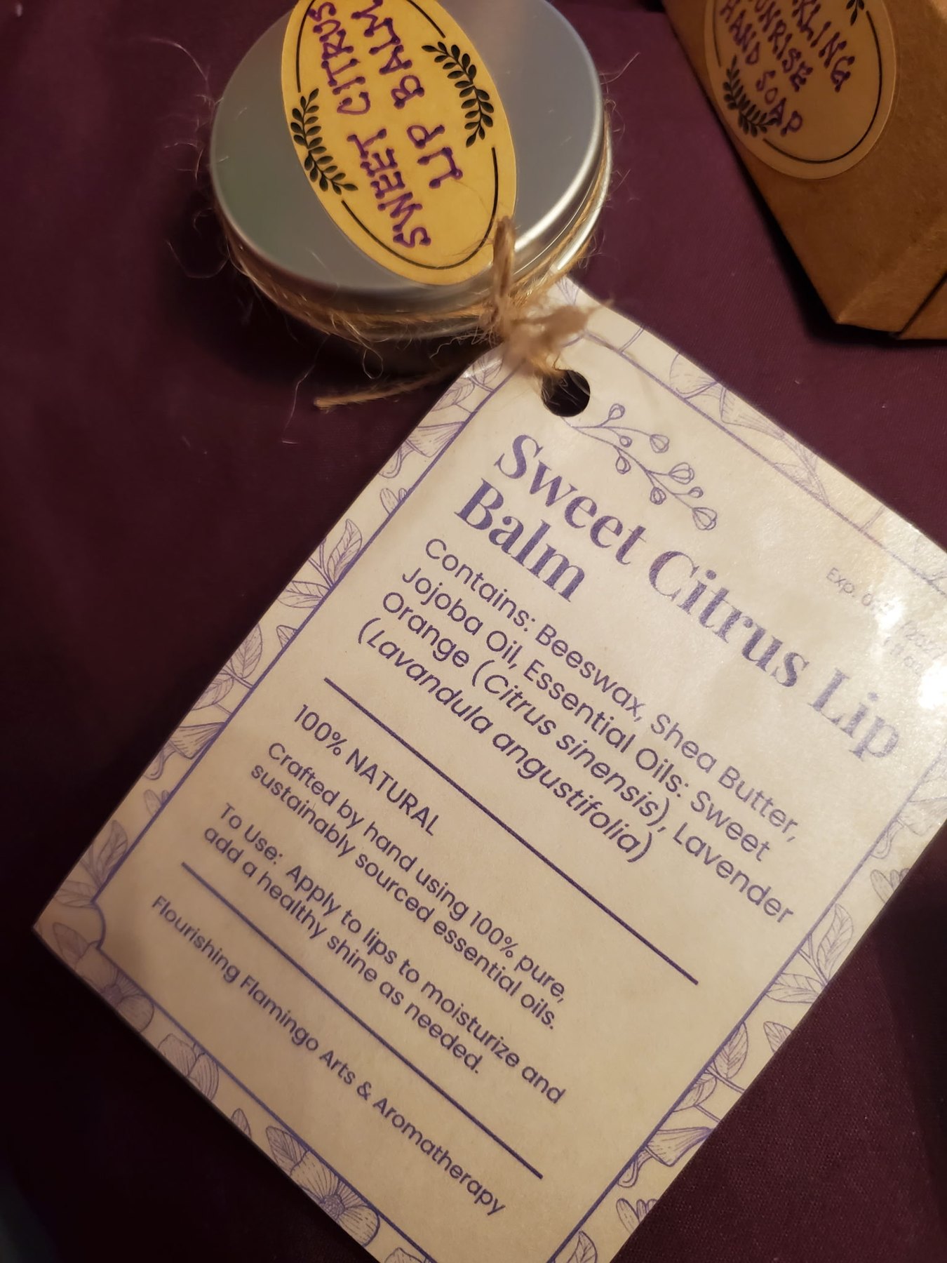 Sweet Citrus Lip Balm with its ingredient tag